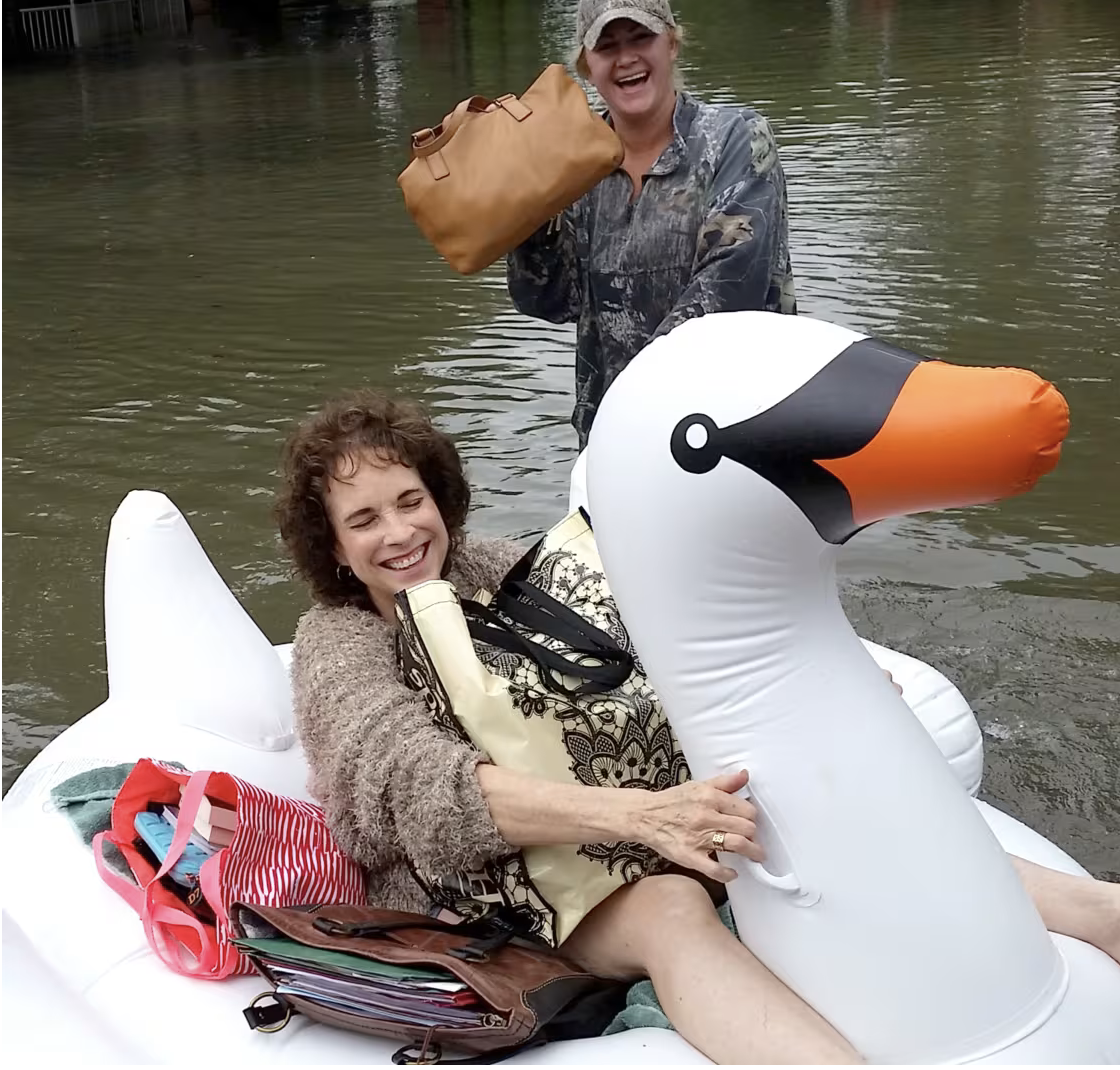 Midwife delivering baby on an inflatable swan